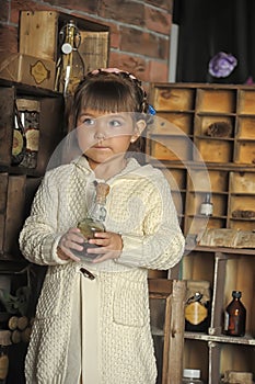 Little girl on the old kitchen