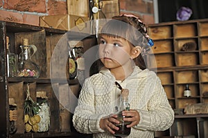 Little girl on the old kitchen