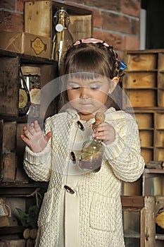 Little girl on the old kitchen