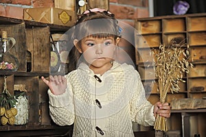 Little girl on the old kitchen