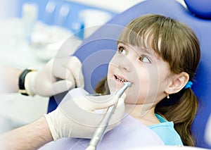 Little girl with open mouth during drilling treatm