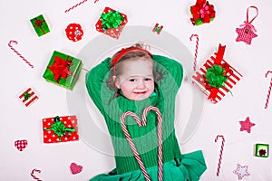 Little girl opening Christmas presents