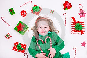 Little girl opening Christmas presents