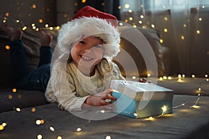 The little girl opening magic gift box
