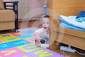 Little girl opening a surprise box in her room