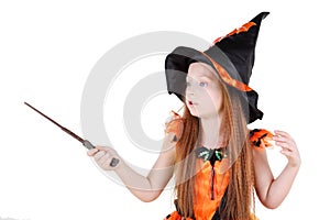 Little girl in orange costume of witch for Halloween photo