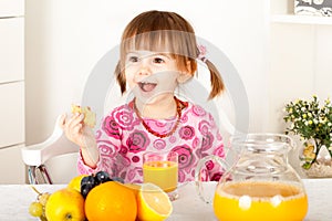 Little girl with orange juice