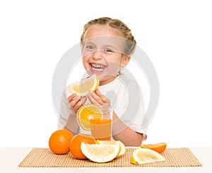 Little girl with oranges drink juice