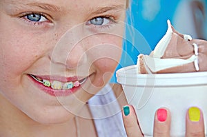 Little girl with orthodontic smile photo