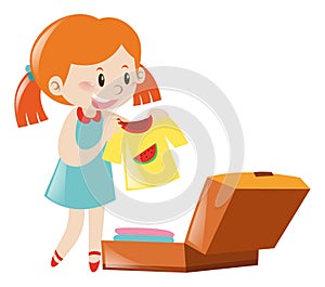 Little girl packing suitcase