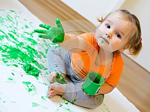 Little girl with paint