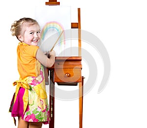 Little girl painting a rainbow