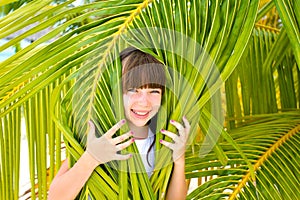 Little girl in palm tree