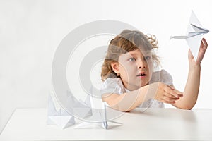 Little girl with paper cranes