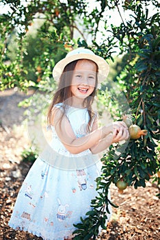 Little girl in the park on summer day