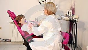 Little girl patient and dentist