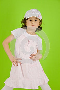 Little girl with peaked cap and summer dress