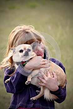 Little girl with pet Chihuahua