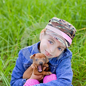 Little girl with pet puppy mascot mini pinscher