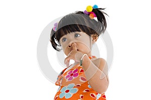 Little girl picking her nose