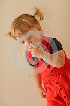 Little girl picking her nose