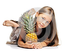 Little girl with pineapple