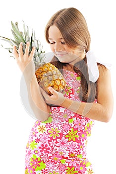 Little girl with pineapple