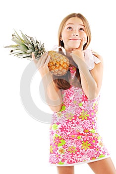 Little girl with a pineapple