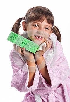 Little girl in pink bathrobe