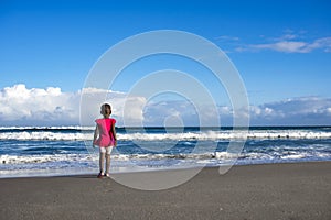 Little Girl in Pink on Beach