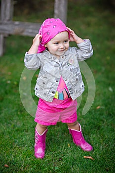 Little girl in pink boots