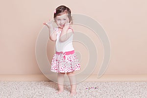 Little girl in a pink dress laughter smile