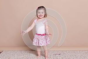 Little girl in a pink dress laughter smile