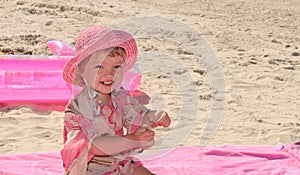 A little girl in the pink environment