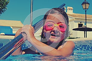 Little girl in pink goggles