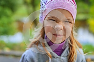 Little girl in a pink hat