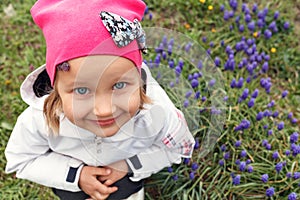 Little girl in a pink hat on a background of glades photo