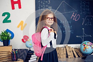 Girl with a school backpack. The concept of school, study, education, friendship, childhood.