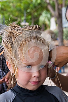 Little girl plaiting braids
