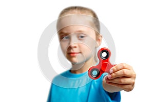 Little girl play with modern finger spinner.