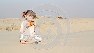 Little girl play panpipe