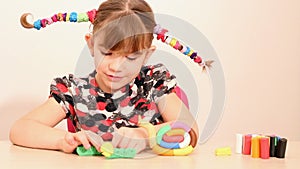 Little girl play with plasticine