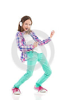 Little girl playing the air guitar