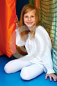 Little girl playing in the amusement park