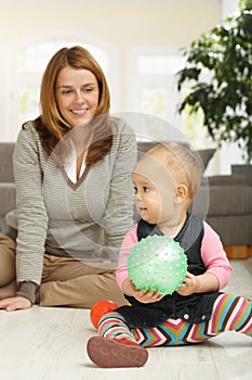 Little girl playing with ball