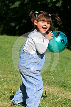 Little Girl Playing Ball