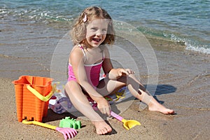 Little girl playing on beach