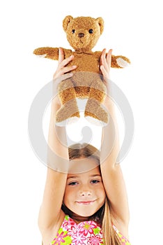 Little girl playing with bear toy