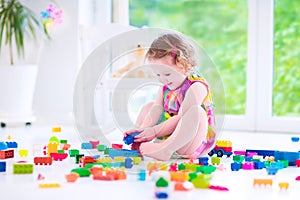 Little girl playing with blocks