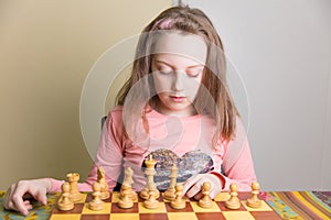 Little girl playing chess